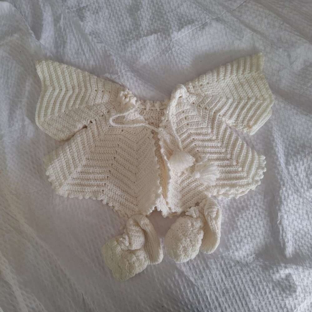 Crocheted baby shawl and booties
